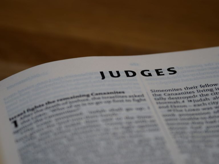 Intimate view of the Book of Judges, highlighting scripture text.