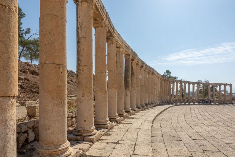 Explore the ancient Roman colonnaded street of Jerash, a historical site in Jordan.